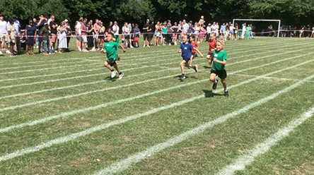 More young children are running a race on the track