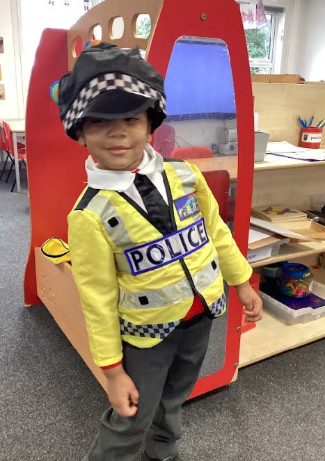 A young pupil dressed a police officer