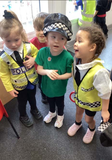 Four pupils, with three dressed as police officers