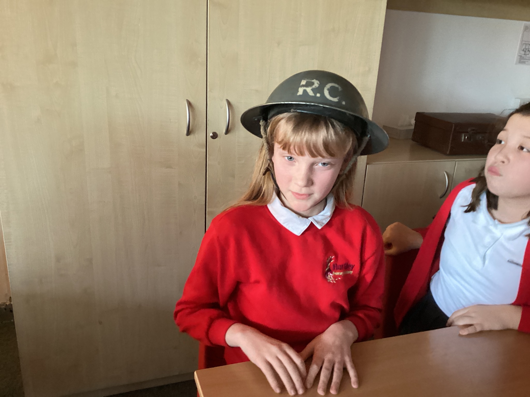 A child smiling wearing a helmet