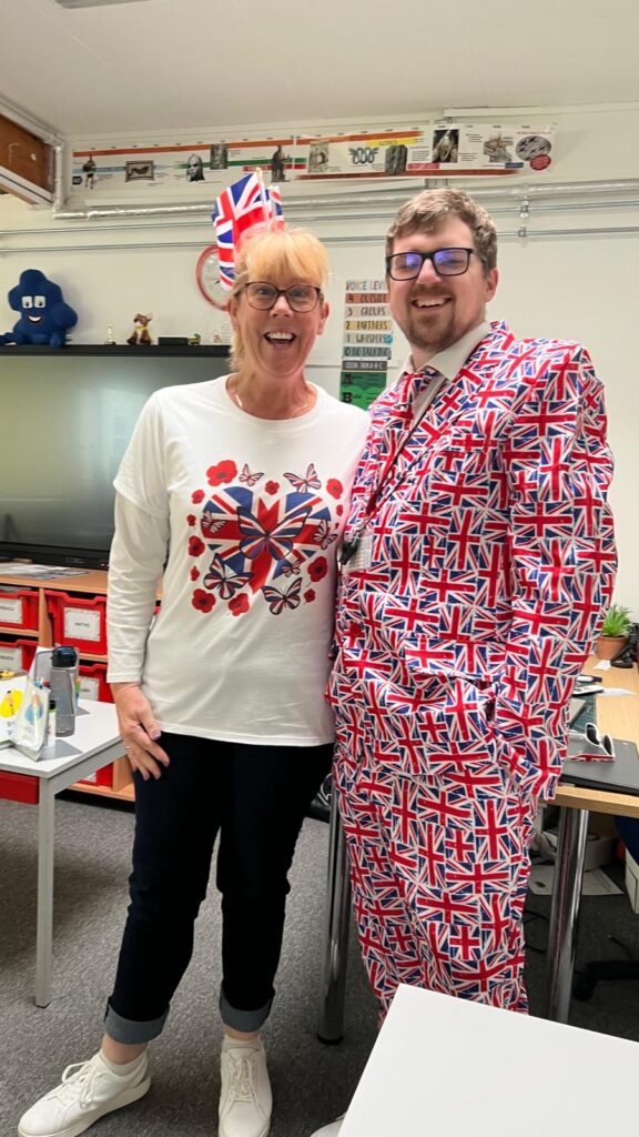 Staff members dressed in union flag items for VE day